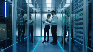 videoblocks-side-view-of-multiethnic-man-and-woman-with-tablets-coworking-in-data-center-server-room-checking-hardware_roje_bbjm_1080__D_AdobeExpress